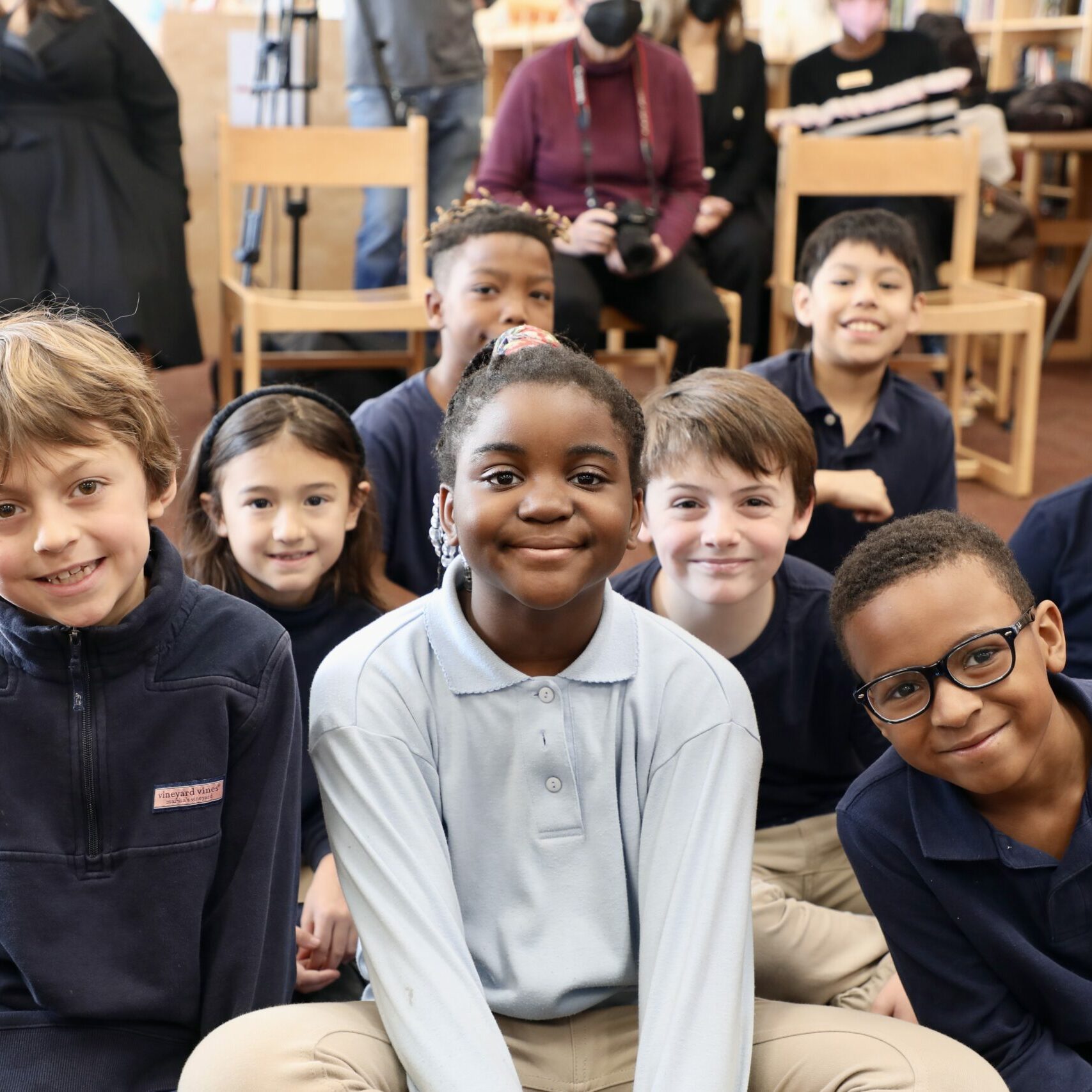 Fanny Jackson Coppin School students sitting on the floor smiling